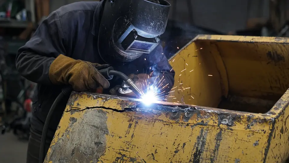 Welding repair of a cracked loader bucket